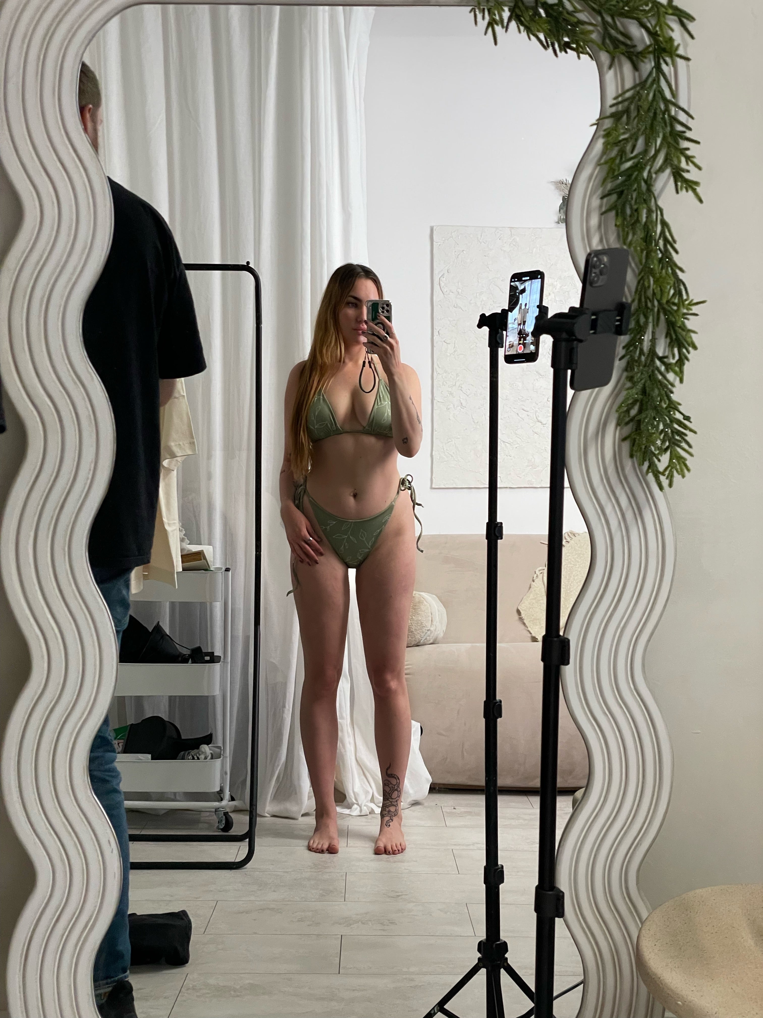 A woman modeling the Olive & Ivory Bikini Set from the back, showcasing the flattering fit of the high-waisted bottoms and square neckline top.