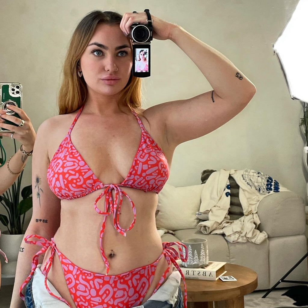 Sustainable Ruby Reef Bikini Set top in red and pink geometric pattern made with recycled plastic. Available in a range of sizes from 2XS to 6XL. Long lasting bikini, multiple ways to wear and buttery soft fabric. Made to order, just for you