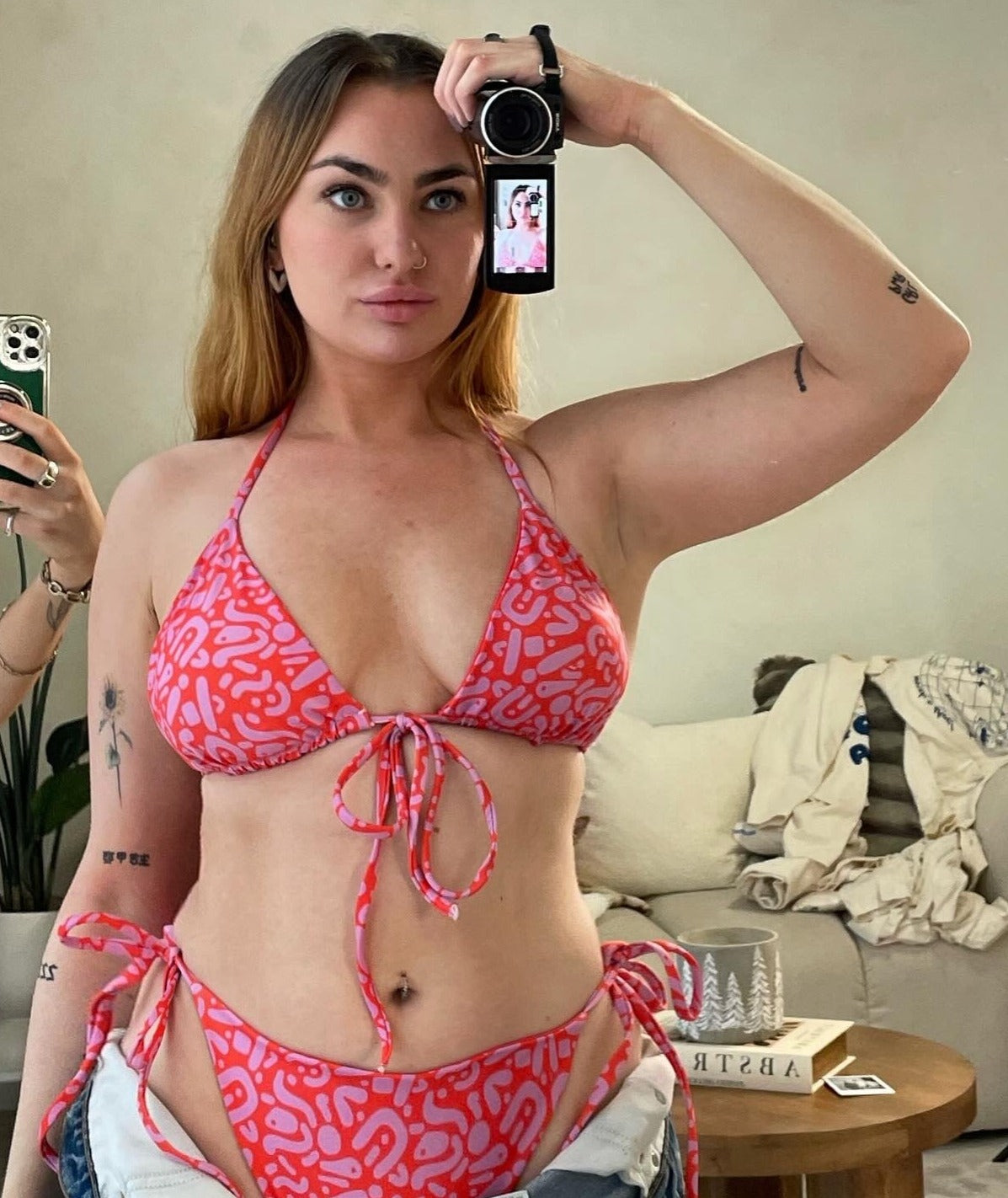 Sustainable Ruby Reef Bikini Set bottoms in red and pink geometric pattern made with recycled plastic. Available in a range of sizes from 2XS to 6XL. Long lasting bikini, multiple ways to wear and buttery soft fabric. Made to order, just for you