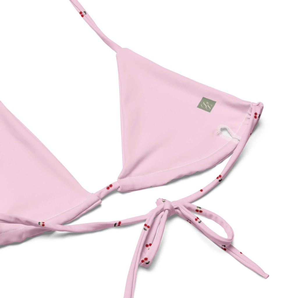 Pink Cherry Orchard bikini top with retro patterns, handmade and sustainable. Perfect for beach time; eco-friendly and stylish for bikini season.