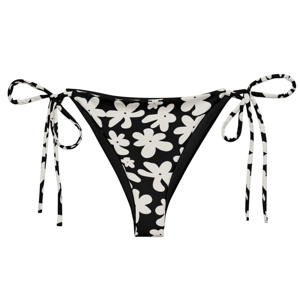 A stylish and comfortable bikini bottom called the Midnight Flower, made from recycled plastic with UPF 50+ sun protection. Part of a larger collection of swimwear also called Midnight Flower, this flattering bikini bottom is available in sizes ranging fr