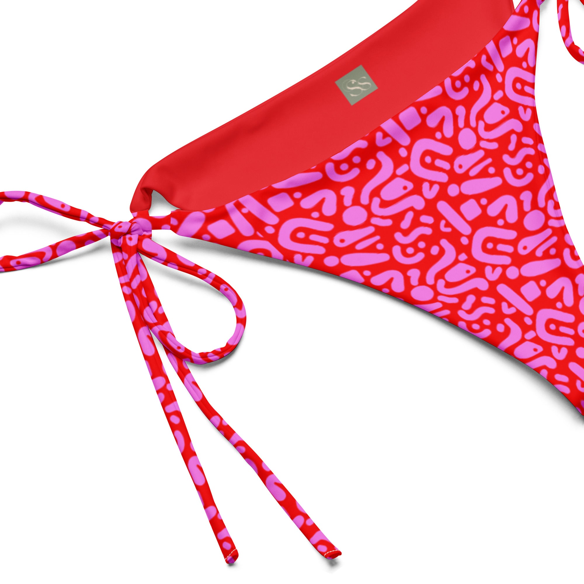 Sustainable Ruby Reef Bikini Set bottoms in red and pink geometric pattern made with recycled plastic. Available in a range of sizes from 2XS to 6XL. Long lasting bikini, multiple ways to wear and buttery soft fabric. Made to order, just for you