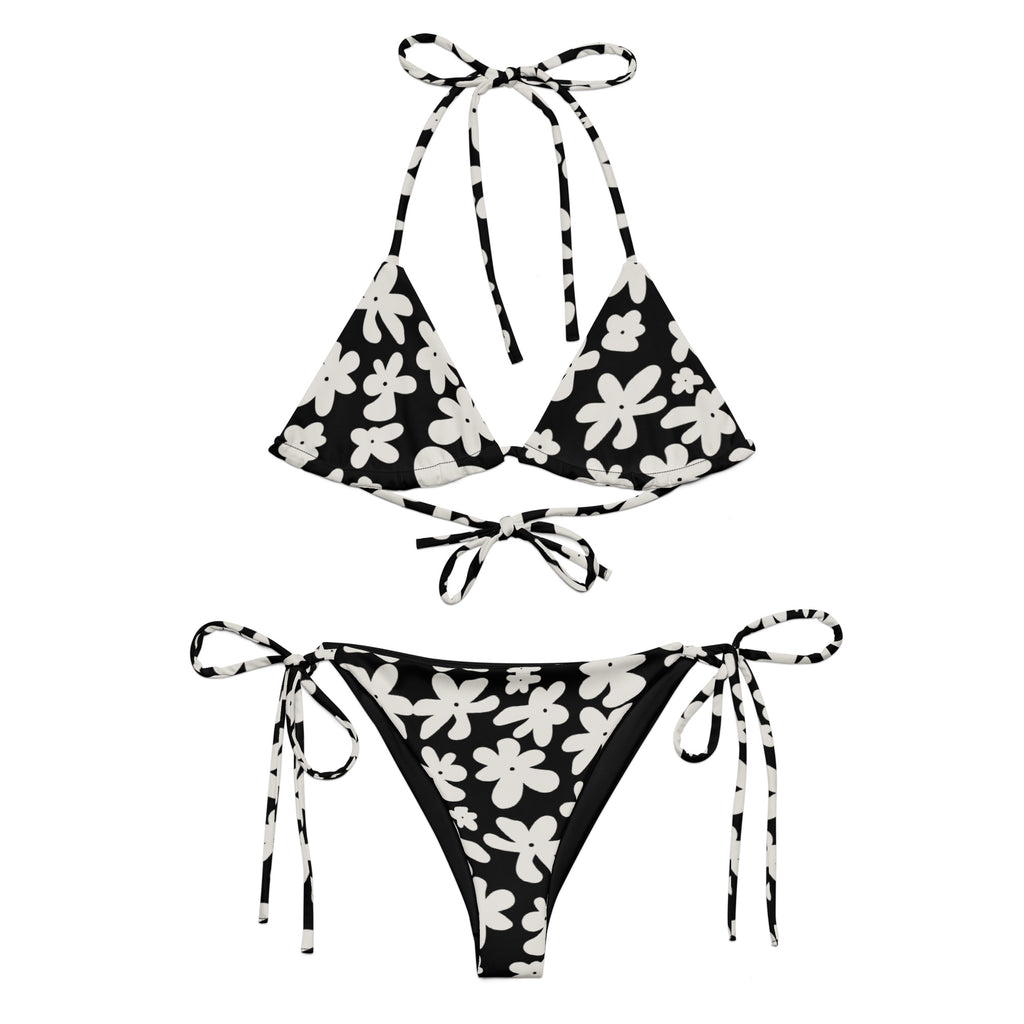 A stylish and comfortable bikini set called the Midnight Flower Bikini Set, made from high-quality, soft, and stretchy recycled material with UPF 50+ sun protection. This eco-friendly bikini set is perfect for swimming, sunbathing, or poolside lounging. I