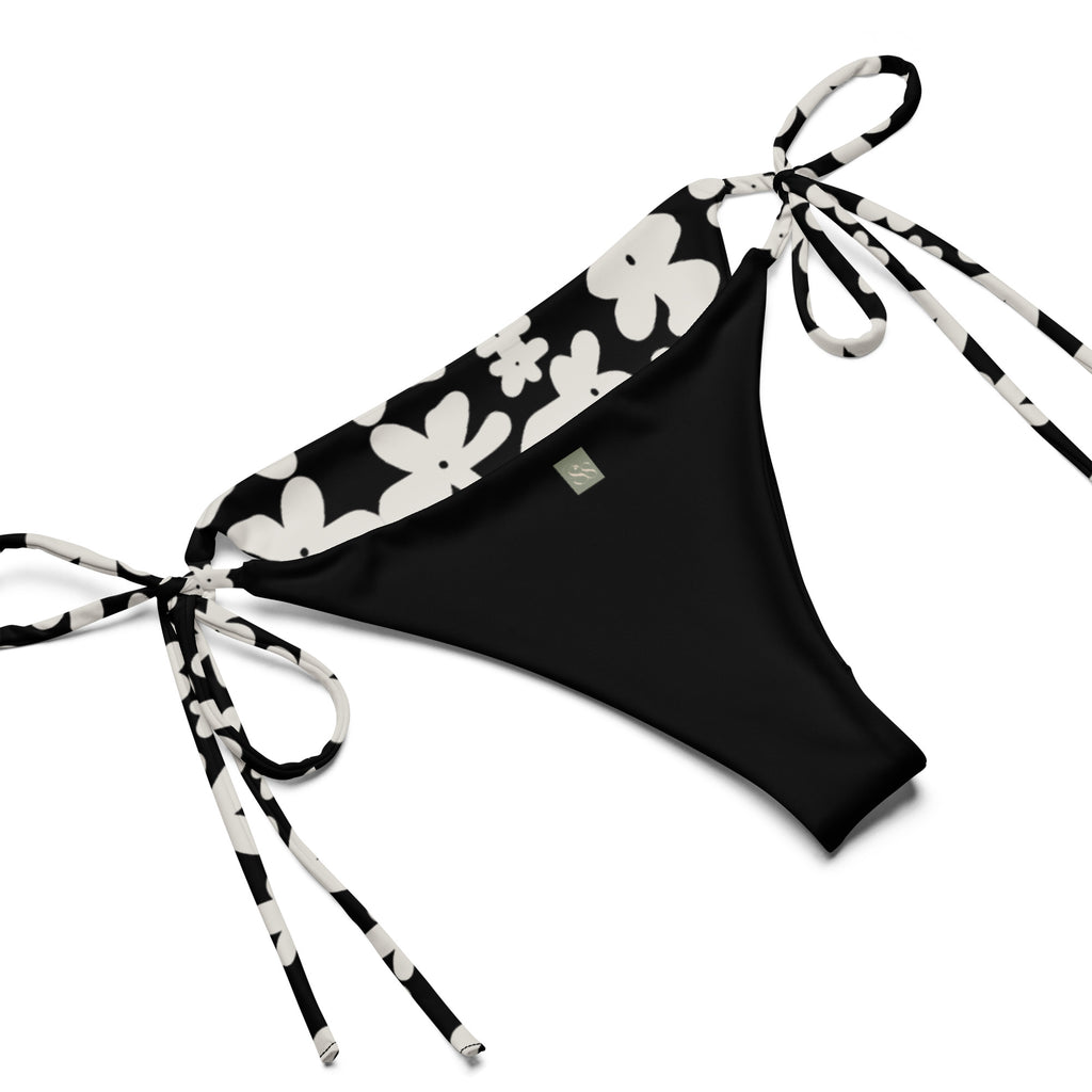 A stylish and comfortable bikini set called the Midnight Flower Bikini Set, made from high-quality, soft, and stretchy recycled material with UPF 50+ sun protection. This eco-friendly bikini set is perfect for swimming, sunbathing, or poolside lounging. I